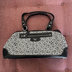 Stylish black and white coach handbag